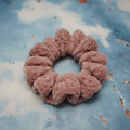 Desert rose scrunchie on patina blue background