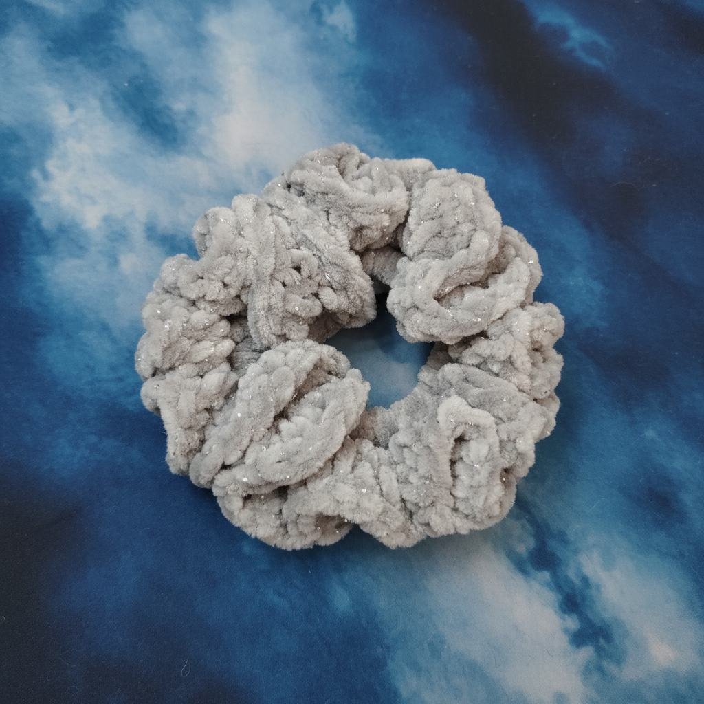 Grey sparkle scrunchie on patina blue background