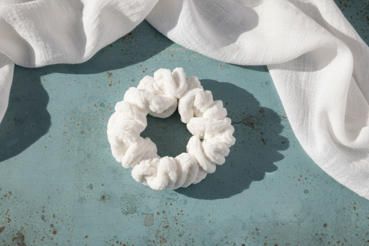White velvet scrunchie flat lay