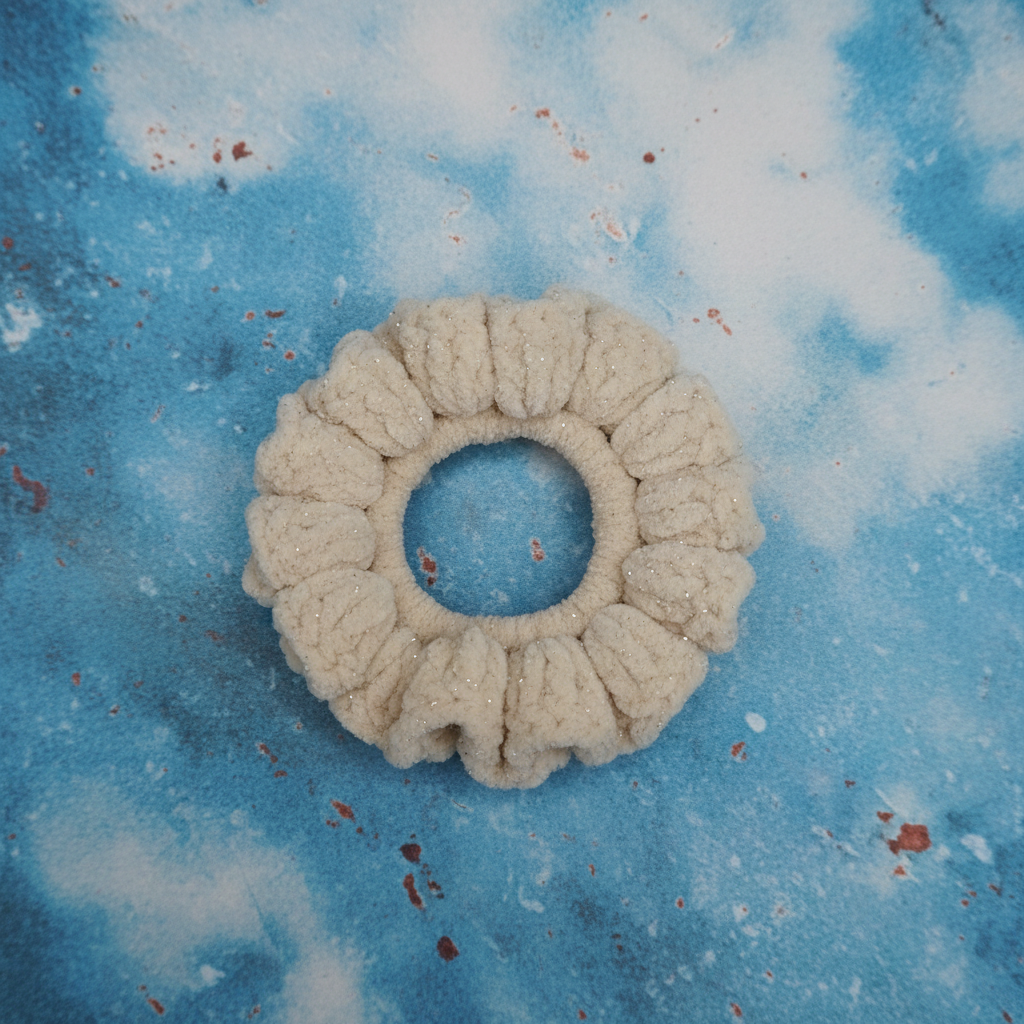 Golden sparkle scrunchie on patina blue background